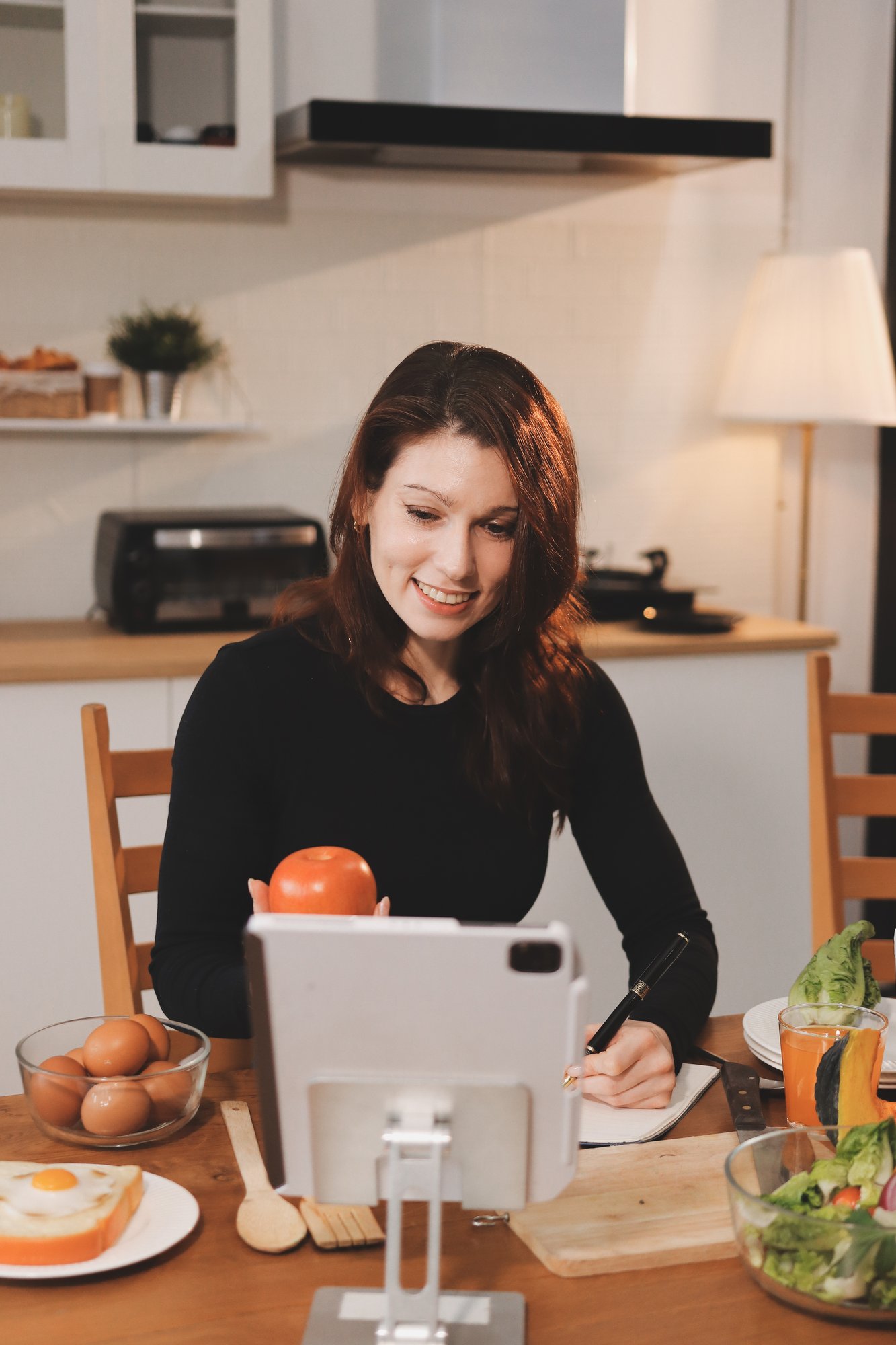 Student cooking in a well-lit home kitchen
